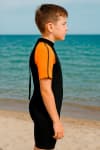 Гидрокостюм для серфинга короткий детский неопреновый 2 мм оранжевый Dewave 100
